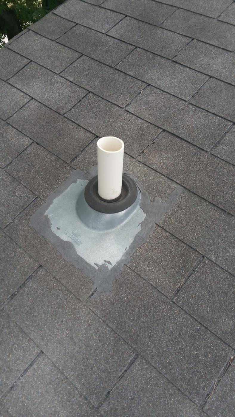 Sealed vent pipe flashing on a shingle roof